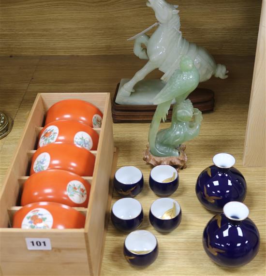 A Japanese porcelain sake set and a boxed set of bowls and two hardstone figures